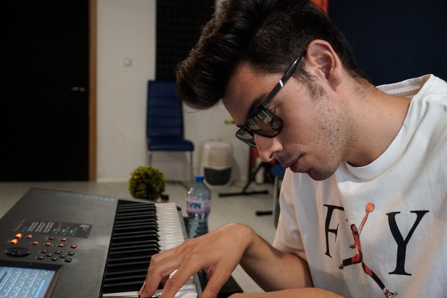 Viktor Nikolov at the keyboard in his studio.